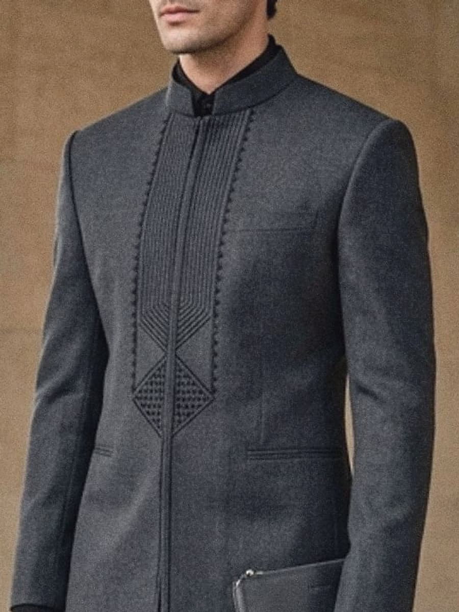 Close view of the tone-on-tone geometric embroidery down the charcoal placket