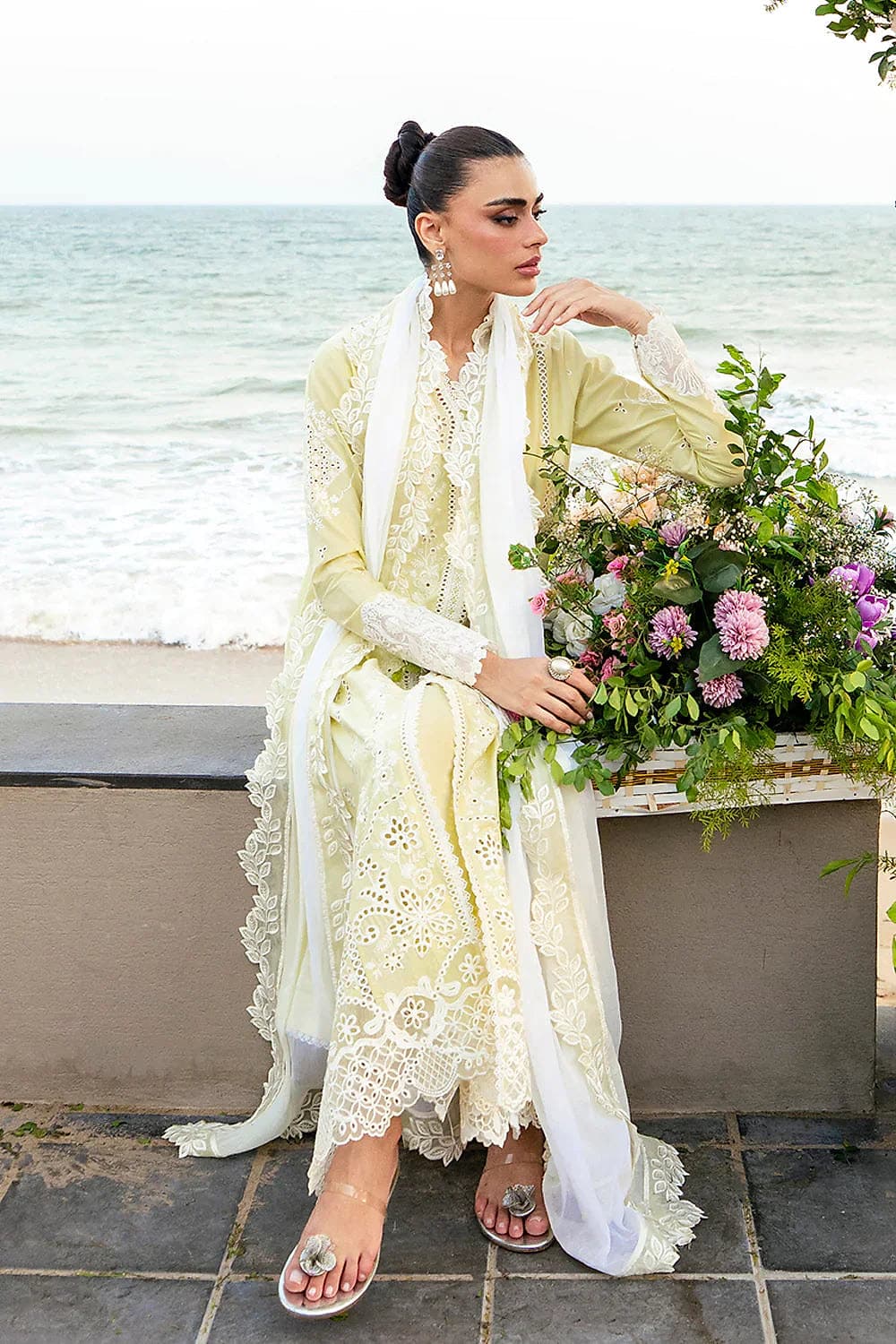 Detailed schiffli eyelet lace on neckline and cuffs